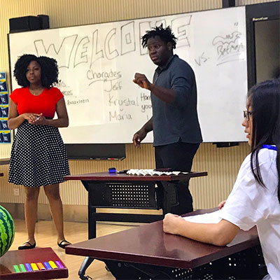 Marcus Lewis (center) and Alexis Moaton teach in China.
