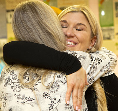 Ashley VanSickle hugs her mother, Michelle Lapp.