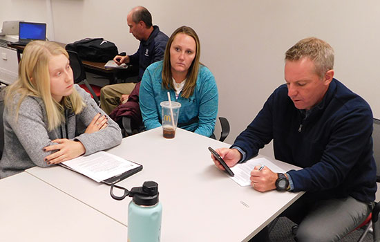 Jim Ressler (right) conducts mock job interviews of P.E. majors.