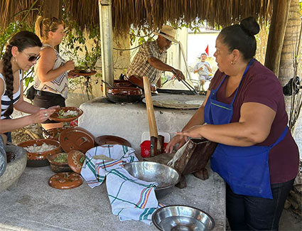 Monday, March 13: Segis and Yadira serve lunch on their ranch.