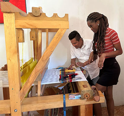 Tuesday, March 14: Rolando, a weaver whose family migrated from Oaxaca to Nayarit, sells woven rugs, linens and other items in his store in Bucerías.