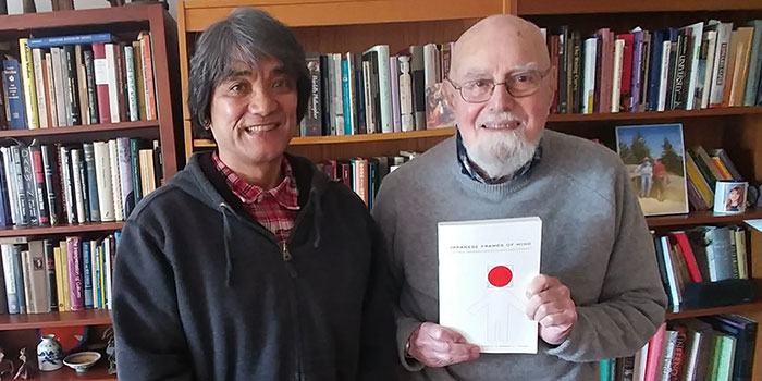 Shimizu and his mentor, Robert A. LeVine, who holds a copy of the book they co-edited.