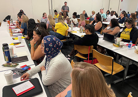 Campers discuss plenary speaker Michael Manderino’s questions.