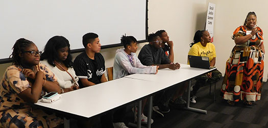 Speaking their truth: Moderator Amonaquenette Parker introduces her “babies” as the panel discussion begins.