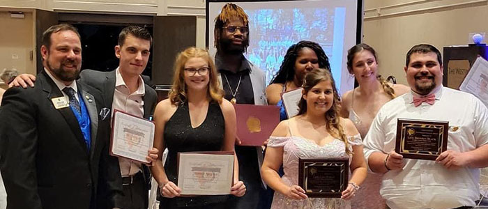 Borgo and Black celebrate an award at The Lions of Illinois Gala for their dedication to Camp Lions.