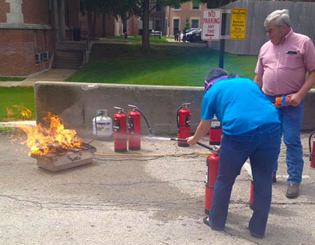 Borgo learned how to extinguish a fire while under sleep shade in her “Cooking without Looking” class at NIU.