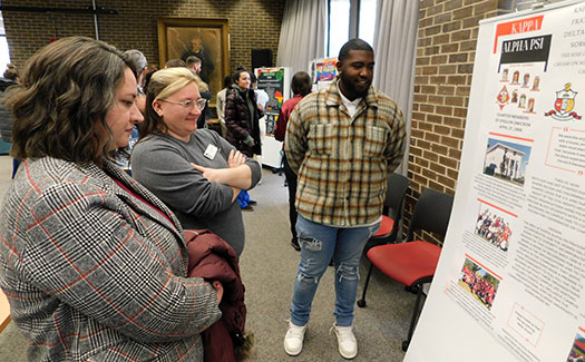 Matthew McConnell, right, discusses his group’s research.