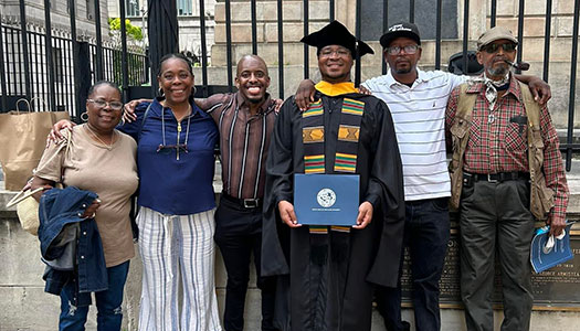 The Hutchings family surrounds Quince after a commencement ceremony.