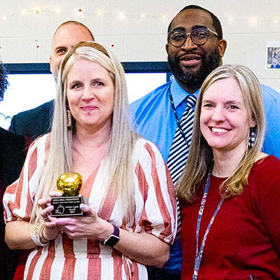 Erin Anderson (right) celebrates fellow NIU College of Education alumna Miranda Thompson’s 2023 Golden Apple.