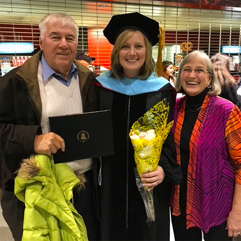 The newly minted Dr. Howerton celebrates at commencement with her parents, Burton and Kathleen Prins.