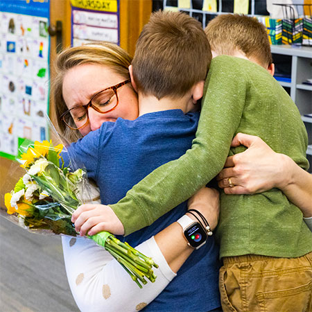 Lisa Robinson hugs her sons.