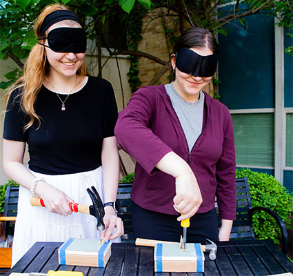 NIU Visual Disabilities students practice skills while wearing sleep-shades.