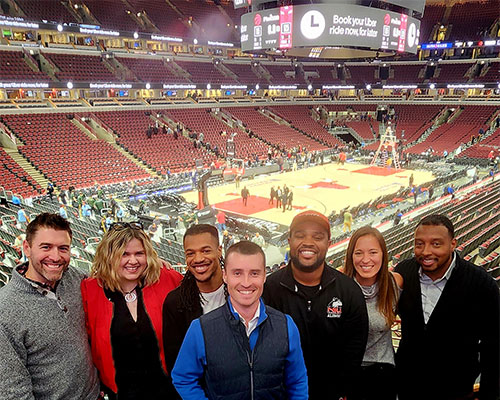 Jenn Jacobs takes in a Chicago Bulls game with FLEX partners and alums.