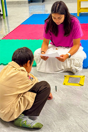 Brianna Cobar teaches one-on-one.