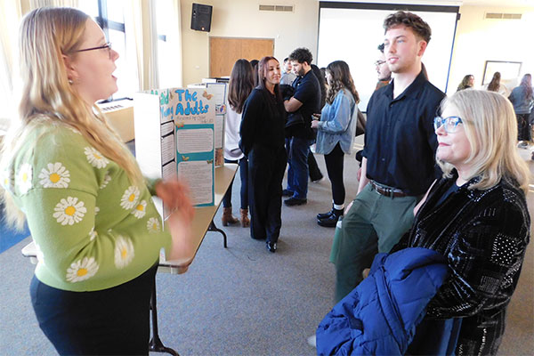 Suzanne Degges-White, chair of the Department of Counseling and Higher Education, chats with a student about her research.