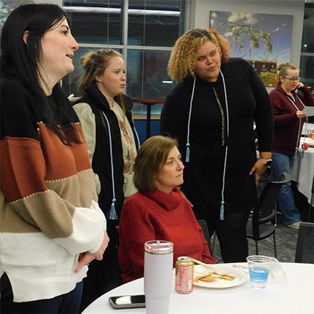 NIU College of Education alumna Abigail Key (left), a teacher in the Rockford Public Schools, attended the completion ceremony and rose to recite the teacher’s creed with the new graduates.