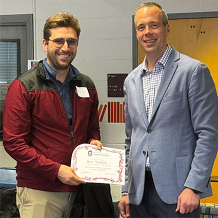 Daniel Truesdale, pictured with Todd Gilson, received the award for best oral presentation for “Sampling Rigor in Instructional Technology Mixed Methods Research.”