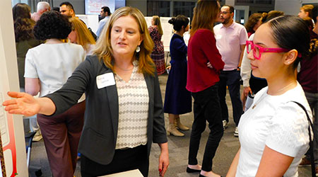 Katie Garcia explains her award-winning poster on “Behavioral Skills Training and Error Correction Implementation.”